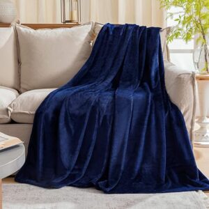 Soft and lightweight navy blue fleece throw blanket, perfect for couch, sofa, or bed, offering warmth and comfort for all seasons.