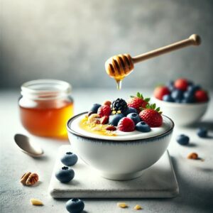 Yogurt bowl topped with fresh berries, nuts, and honey.